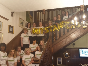 Nus Ghani with care workers at High Broom Care Centre.